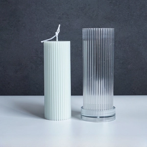 Detail of 5x15cm cylindrical ribbed candle mold with textured green candle finish