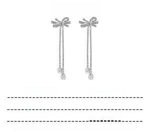 Detail showing bow knot tassel earrings with zircon crystals and silver-tone finish