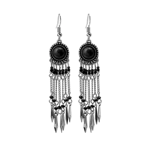 Detailed view of bohemian tassel earrings with black gemstones and silver chain fringe