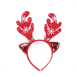 Christmas headband with red sequin reindeer antlers and snowflake patterns on white background