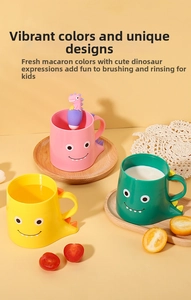 Detailed view of cartoon dinosaur children cups with matching spoons in soft pastel colors