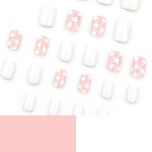 Minimalist short square press-on nails featuring pink star patterns and solid white glossy finish