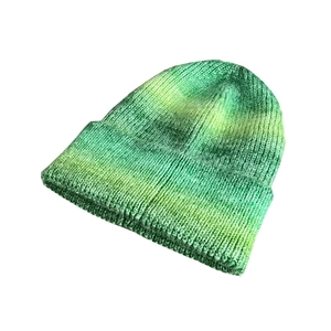 Green and yellow tie-dye gradient knit beanie for women in a warm chunky winter style