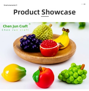 Macro shot of realistic miniature resin fruit models in a wooden tray on white background