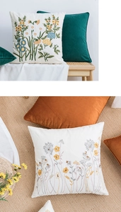 Detailed close-up of floral embroidery on cotton canvas pillow covers in nordic style