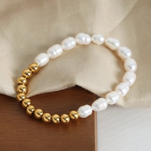 Elegant gold plated titanium steel bracelet with baroque pearls and gold round beads