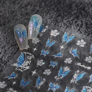 Blue butterfly and white flower nail stickers on aurora base with matte finish