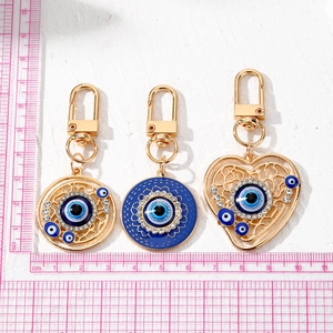 Vintage Turkish Evil Eye heart keychains with gold plating and blue enamel accents
