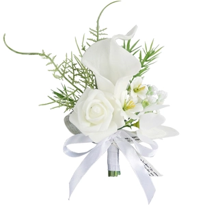 Elegant white calla lily and rose boutonniere with satin ribbon for wedding groom and bride