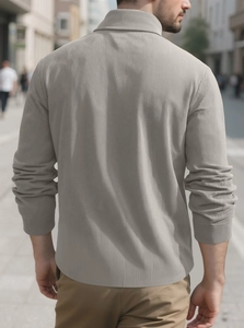 Detail of grey ribbed corduroy jacket texture and tailored fit on men's casual shirt