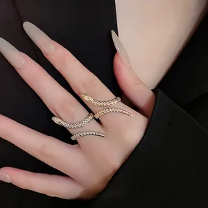 Chic snake-shaped gold and silver ring set featuring intricate metal scale engraving detail