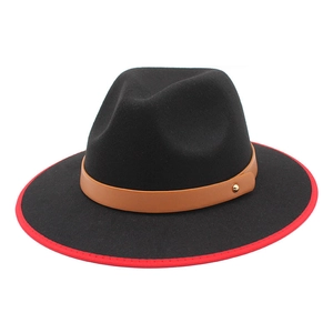 Close-up of black wool fedora featuring red edge trim and brown leather band with stud
