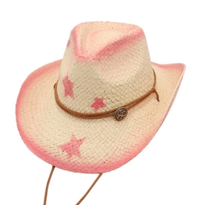 Detail of pink straw cowboy hat with star patterns and brown adjustable drawstring