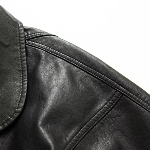 Black vintage PU leather jacket featuring detailed shoulder stitching and premium texture
