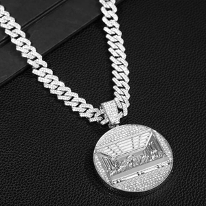 Silver iced out Cuban link necklace with a Last Supper relief round pendant
