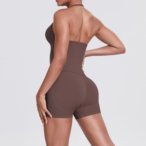 Rear view of dark brown halter neck sports bra and high waisted yoga shorts set