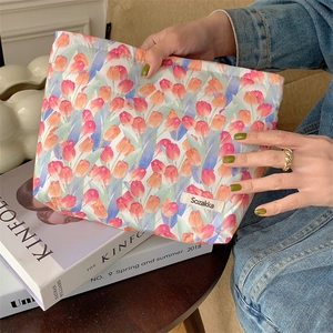 Handheld floral cotton pouch with tulip prints and minimalist canvas aesthetic