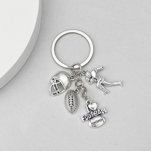 Detailed view of silver football keychain with helmet, ball, player, and I Love Football charms