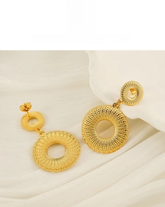 Detail of 18K gold-plated double-layered hoop earrings with sunburst texture on silk