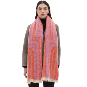 Pink and orange geometric jacquard scarf with soft fringe details on white background