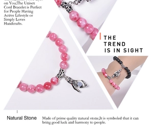 Detail of magnetic palm charms joining natural stone and black onyx beaded bracelets