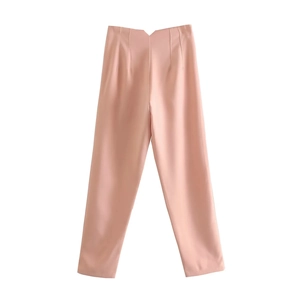 Detail view of pink high-waist casual trousers with classic center fold line and flat texture
