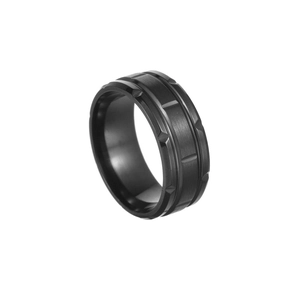 Detail of black titanium steel ring with brushed surface and grooved decorative accents