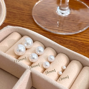 Detail view of pearl stud earring set in four sizes 10mm 8mm 6mm and 3mm diameter