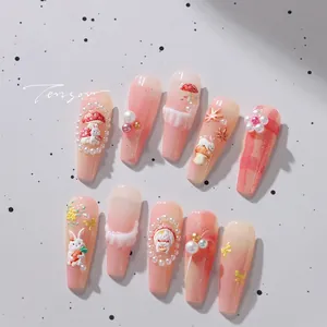 Detail view of 3D resin rabbit and mushroom charms on Japanese style press-on nails