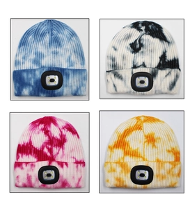 Detail of colorful tie-dye knit beanies with built-in LED lights in multiple colors