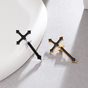 Gothic punk style cross stud earrings in silver and gold metal with black enamel finish
