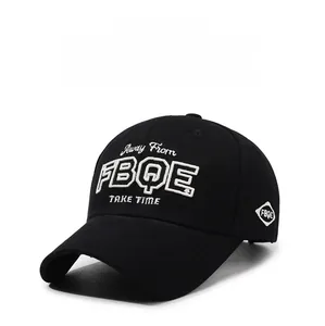 Detail of black cotton baseball cap featuring high-density 3D white embroidery and curved brim