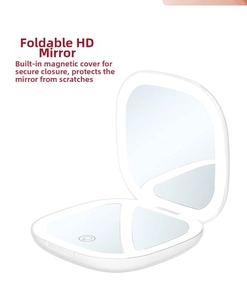 Close-up of the magnetic closure and touch sensor on the folding LED makeup mirror