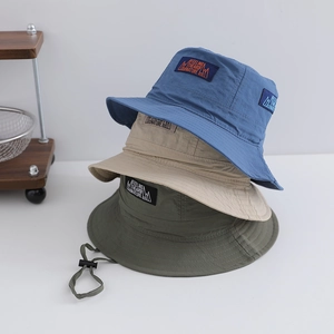 Stacked kids quick-dry bucket hats in royal blue, khaki and green with nature logo patch