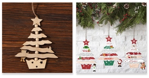Close-up of layered wooden Christmas tree ornaments with festive Merry Christmas prints