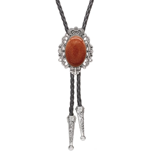 Detail view of silver crown bolo tie with oval brown agate stone and braided leather cord