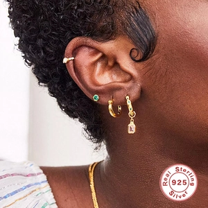S925 sterling silver gold earrings set with opal and green zircon on female model