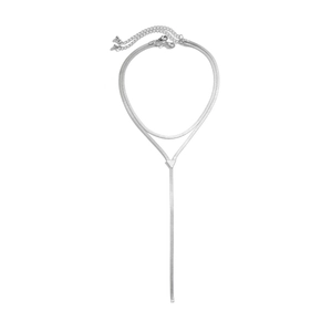 Detail of silver double-layered snake bone chain necklace with triangle connector
