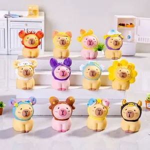 Set of 12 cute resin capybara figurines with diverse animal hats on a display stand