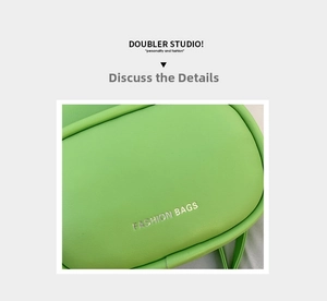 Detail of neon green leather bag featuring silver Fashion Bags embossed text and grain