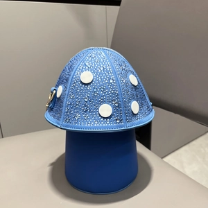 Close-up of sparkling blue mushroom handbag with rhinestone details and metal hardware
