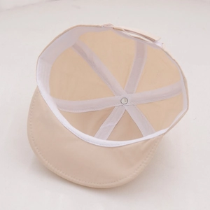 Detail of baby sun hat interior showing breathable mesh lining and adjustable velcro strap