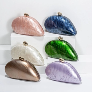 Multiple marble acrylic evening clutch bags with gold spherical clasps in various colors
