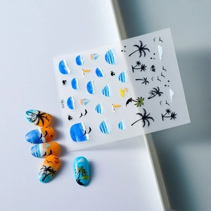 Detail of 5D embossed nail stickers featuring tropical ocean waves and palm tree patterns