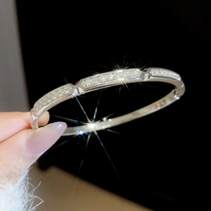 Close-up detail of silver-colored bracelet with pavé-set cubic zirconia stones