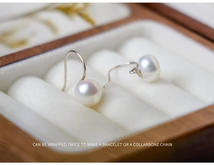 Detail of 8-9mm natural freshwater white pearl earrings with elegant s925 silver hooks