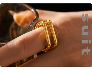 Detail shot of a double-layered hollow U-shaped geometric ring in 18K gold-plated stainless steel