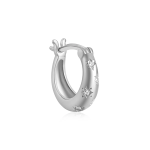 Macro shot of S925 sterling silver hoop earring with sparkling star-shaped diamond accents
