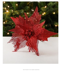 Close-up of artificial red poinsettia with sparkling glitter and mesh petals for Christmas