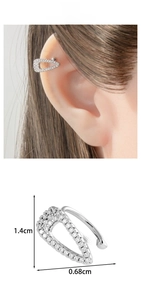 Macro view of a U-shaped silver ear cuff with cubic zirconia inlay and size dimensions